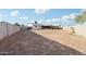 Spacious backyard with a detached garage/shed and mature trees providing shade at 3410 E Everett Dr, Phoenix, AZ 85032