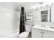 Bright bathroom with white vanity, shower with curtain, and neutral decor at 3410 E Everett Dr, Phoenix, AZ 85032