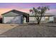 Charming single story home featuring an attached two-car garage and low maintenance landscaping at 3410 E Everett Dr, Phoenix, AZ 85032