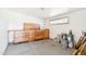 Well-lit garage with built-in cabinets and a work bench, providing ample storage space at 3410 E Everett Dr, Phoenix, AZ 85032
