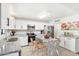 Modern kitchen featuring white cabinets, stainless steel appliances, and granite countertops with seating for dining at 3410 E Everett Dr, Phoenix, AZ 85032