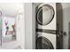 Convenient laundry area with a modern stacked washer and dryer unit at 3410 E Everett Dr, Phoenix, AZ 85032
