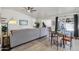 Spacious living room with tile flooring, ceiling fan, and slider to the backyard at 3410 E Everett Dr, Phoenix, AZ 85032
