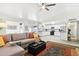Open floor plan with living room and kitchen, neutral decor and tile floors, and lots of natural light at 3410 E Everett Dr, Phoenix, AZ 85032
