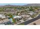 An aerial view of the home showcasing the pool, landscaping, and surrounding neighborhood at 3611 E Ahwatukee Dr, Phoenix, AZ 85044