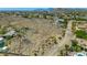 Aerial shot showing a desert backyard with pool and privacy, set against a mountain landscape at 3611 E Ahwatukee Dr, Phoenix, AZ 85044