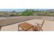 View of balcony featuring a tile floor, mountain views, and a wooden table and chair set at 3611 E Ahwatukee Dr, Phoenix, AZ 85044