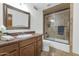 Bathroom with a vanity sink, mirror, and tiled shower at 3611 E Ahwatukee Dr, Phoenix, AZ 85044