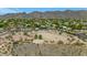 Scenic view of an equestrian facility with horse rings and desert landscape, nestled against a mountain backdrop at 3611 E Ahwatukee Dr, Phoenix, AZ 85044
