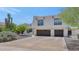 Photo of home featuring a southwestern style home, desert landscaping, and a two-car garage at 3611 E Ahwatukee Dr, Phoenix, AZ 85044