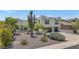 Southwestern home with desert landscaping, two-car garage, and mature trees at 3611 E Ahwatukee Dr, Phoenix, AZ 85044
