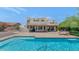 Exterior of home with a swimming pool and patio area for outdoor entertainment at 3611 E Ahwatukee Dr, Phoenix, AZ 85044