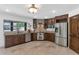 Well-equipped kitchen with stainless steel appliances, custom cabinetry and stone countertops at 3611 E Ahwatukee Dr, Phoenix, AZ 85044