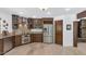 Beautiful kitchen featuring custom wood cabinets, stainless steel appliances, and stylish backsplash at 3611 E Ahwatukee Dr, Phoenix, AZ 85044