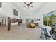Open concept living space with wood beam accents, neutral tones, and large picture windows at 3611 E Ahwatukee Dr, Phoenix, AZ 85044