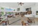 Spacious living room with open floor plan, featuring large windows and access to outdoor pool area at 3611 E Ahwatukee Dr, Phoenix, AZ 85044