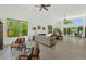 Spacious living room with high ceilings, neutral decor, large windows, and ample natural light at 3611 E Ahwatukee Dr, Phoenix, AZ 85044