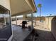 Covered patio and grill in a spacious backyard with desert landscaping and block fence at 4008 E Knox Rd, Phoenix, AZ 85044