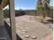Large backyard with desert landscaping, block fence, and stepping stones at 4008 E Knox Rd, Phoenix, AZ 85044