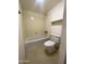 Modest bathroom features a bathtub, toilet, and neutral color scheme at 4008 E Knox Rd, Phoenix, AZ 85044