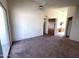 Spacious bedroom with a vaulted ceiling, ceiling fan and sliding glass doors to the outside at 4008 E Knox Rd, Phoenix, AZ 85044