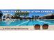 A beautiful shot of the Ahwatukee Recreation Center with its sparkling pool at 4008 E Knox Rd, Phoenix, AZ 85044