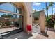 Backyard patio area featuring a wrought iron table and chairs and desert landscaping at 4015 N 78Th St # 135, Scottsdale, AZ 85251