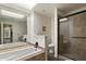 Bright bathroom featuring a large bathtub with shower and tiled shower with glass enclosure at 4015 N 78Th St # 135, Scottsdale, AZ 85251