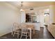 Cozy dining area with a wooden table set, adjacent to the kitchen and entryway at 4015 N 78Th St # 135, Scottsdale, AZ 85251