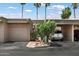 Charming single-story home with a one-car garage and a carport nestled beneath swaying palm trees at 4015 N 78Th St # 135, Scottsdale, AZ 85251
