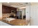 Well-equipped kitchen with granite countertops, stainless steel appliances, and ample cabinet space at 4015 N 78Th St # 135, Scottsdale, AZ 85251