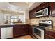 Updated kitchen with stainless steel appliances, granite counters, and tile backsplash at 4015 N 78Th St # 135, Scottsdale, AZ 85251