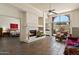 Cozy living space with fireplace, tile floors, and a view to the bedroom and outdoor patio at 4015 N 78Th St # 135, Scottsdale, AZ 85251