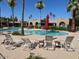 Community pool area featuring lounge chairs and meticulously kept landscaping to enhance outdoor enjoyment at 4015 N 78Th St # 135, Scottsdale, AZ 85251