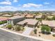 Aerial view of the home showcasing the well-manicured front yard and beautiful neighborhood at 42726 N Livingstone Way, Anthem, AZ 85086