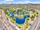 Aerial view of the park, showcasing a series of ponds, playgrounds, and sports fields at 42726 N Livingstone Way, Anthem, AZ 85086