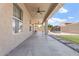 Covered back patio with a ceiling fan overlooking the backyard, providing a relaxing outdoor space at 42726 N Livingstone Way, Anthem, AZ 85086