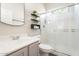 Clean bathroom featuring a shower, modern vanity, and decorative shelving at 42726 N Livingstone Way, Anthem, AZ 85086