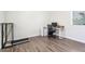 This bedroom features wood floors and an office space, offering a versatile and functional area at 42726 N Livingstone Way, Anthem, AZ 85086