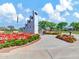 Memorial in a park showcasing red and white flowers and lush greenery surrounding a granite structure at 42726 N Livingstone Way, Anthem, AZ 85086