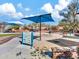 Shaded playground featuring soft sand, climbing structures, and engaging play equipment at 42726 N Livingstone Way, Anthem, AZ 85086