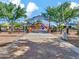 Playground entrance showcasing the adventure playground and splash pad beyond the railway crossing sign at 42726 N Livingstone Way, Anthem, AZ 85086