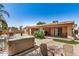 Backyard with a hot tub, patio furniture, desert landscaping, and an inviting outdoor space for relaxation at 4345 E Annette Dr, Phoenix, AZ 85032