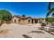 Home exterior featuring a patio, lush landscaping, and a well-maintained backyard under a sunny sky at 4345 E Annette Dr, Phoenix, AZ 85032