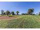 Golf course view of the green with beautiful, mature trees and a sand trap at 4345 E Annette Dr, Phoenix, AZ 85032