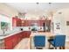 Updated kitchen featuring custom cabinets, stainless steel appliances, and eat-in island at 4345 E Annette Dr, Phoenix, AZ 85032