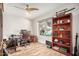 Home office with a built-in bookcase, ceiling fan and large window at 4345 E Annette Dr, Phoenix, AZ 85032