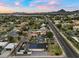 Scenic aerial shot showcasing a home with solar panels in a vibrant neighborhood with mountain views at 4400 N 20Th St, Phoenix, AZ 85016