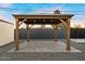 Charming backyard gazebo with string lights and stone paver flooring is perfect for outdoor entertaining at 4400 N 20Th St, Phoenix, AZ 85016