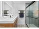 Modern bathroom featuring updated vanity, sleek lighting, and frameless glass shower at 4400 N 20Th St, Phoenix, AZ 85016